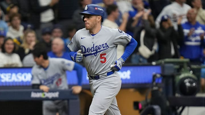 Los Angeles Dodgers first baseman Freddie Freeman (5) homers to right field during the sixth inning of the National League Championship Series game against the Milwaukee Brewers October 13, 2025 at American Family Field in Milwaukee, Wisconsin. Los Angeles Dodgers first baseman Freddie Freeman (5) homers to right field during the sixth inning of the National League Championship Series game against the Milwaukee Brewers October 13, 2025 at American Family Field in Milwaukee, Wisconsin.