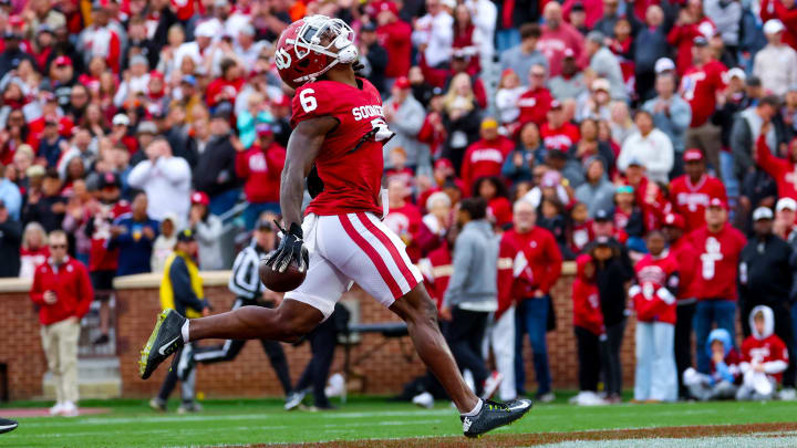 Apr 20, 2024; Norman, OK, USA;  Oklahoma Sooners wide receiver Deion Burks (6) celebrates after catching a touchdown pass  during the Oklahoma Sooners spring game at Gaylord Family OK Memorial Stadium. Mandatory Credit: Kevin Jairaj-USA TODAY Sports