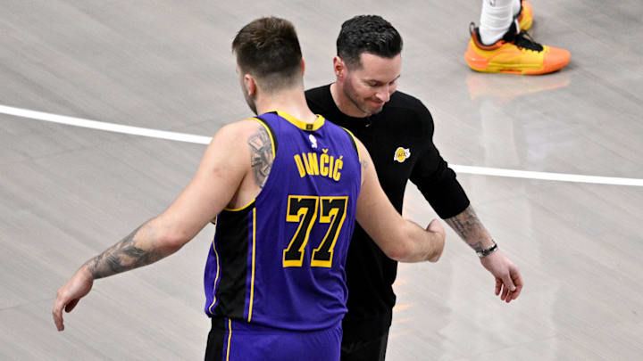 Apr 9, 2025; Dallas, Texas, USA; Los Angeles Lakers head coach JJ Redick and guard Luka Doncic (77) during the game between the Dallas Mavericks and the Los Angeles Lakers at American Airlines Center. Mandatory Credit: Jerome Miron-Imagn Images Apr 9, 2025; Dallas, Texas, USA; Los Angeles Lakers head coach JJ Redick and guard Luka Doncic (77) during the game between the Dallas Mavericks and the Los Angeles Lakers at American Airlines Center. Mandatory Credit: Jerome Miron-Imagn Images