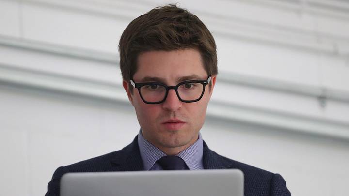 Sep 18, 2018; Lucan, Ontario, CAN; Toronto Maple Leafs general manager Kyle Dubas on his laptop before the start of their game against the Ottawa Senators at Lucan Community Memorial Centre.  The Maple Leafs beat the Senators 4-1. Mandatory Credit: Tom Szczerbowski-Imagn Images