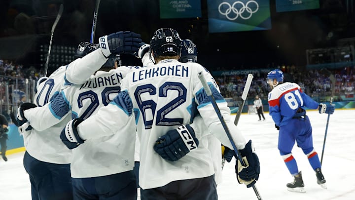 Feb 11, 2026; Milan, Italy; Eeli Tolvanen of Finland celebrates scoring their first goal with teammates against Slovakia in men's ice hockey group B play during the Milano Cortina 2026 Olympic Winter Games at Milano Santagiulia Ice Hockey Arena. Mandatory Credit: Geoff Burke-Imagn Images Feb 11, 2026; Milan, Italy; Eeli Tolvanen of Finland celebrates scoring their first goal with teammates against Slovakia in men's ice hockey group B play during the Milano Cortina 2026 Olympic Winter Games at Milano Santagiulia Ice Hockey Arena. Mandatory Credit: Geoff Burke-Imagn Images