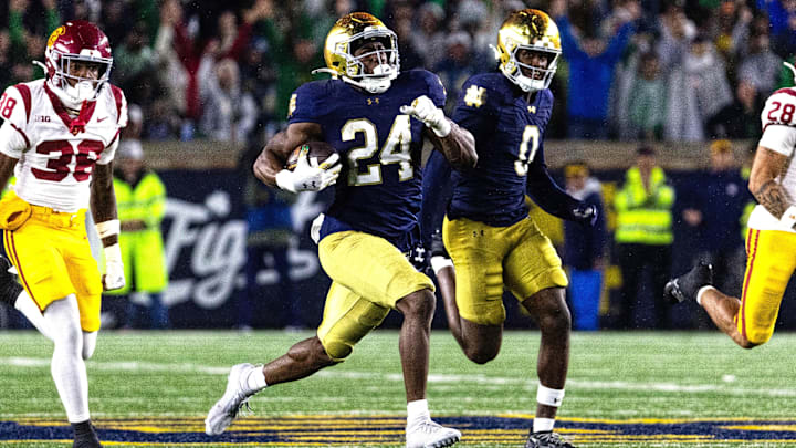Oct 18, 2025; South Bend, Indiana, USA; Notre Dame Fighting Irish running back Jadarian Price (24) runs back the kickoff for a touchdown in the second half against the Southern California Trojans at Notre Dame Stadium. Mandatory Credit: Trevor Ruszkowski-Imagn Images
