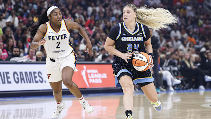 Jul 27, 2025; Chicago, Illinois, USA; Chicago Sky guard Rachel Banham (24) drives to the basket against Indiana Fever guard Aari McDonald (2) during the second half at United Center. Mandatory Credit: Kamil Krzaczynski-Imagn Images