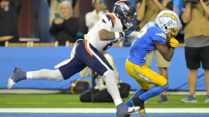 Dec 19, 2024; Inglewood, California, USA; Los Angeles Chargers wide receiver Derius Davis (12) hangs on to a touchdown pass as he is defended by Denver Broncos safety P.J. Locke (6) in the second half at SoFi Stadium. Mandatory Credit: Jayne Kamin-Oncea-Imagn Images Dec 19, 2024; Inglewood, California, USA; Los Angeles Chargers wide receiver Derius Davis (12) hangs on to a touchdown pass as he is defended by Denver Broncos safety P.J. Locke (6) in the second half at SoFi Stadium. Mandatory Credit: Jayne Kamin-Oncea-Imagn Images