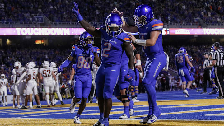 Sep 28, 2024; Boise, Idaho, USA; Boise State Broncos running back Ashton Jeanty (2) and quarterback Maddux Madsen (4) celebrate during the second quarter against the Washington State Cougars at Albertsons Stadium. Mandatory Credit: Brian Losness-Imagn Images