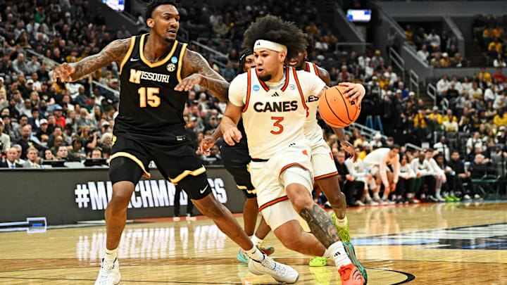 Mar 20, 2026; St. Louis, MO, USA; Miami (FL) Hurricanes guard Tre Donaldson (3) drives to the basket as Missouri Tigers center Shawn Phillips Jr. (15) defends during the second half during a first round game of the men's 2026 NCAA Tournament at Enterprise Center. Mandatory Credit: Jeff Le-Imagn Images