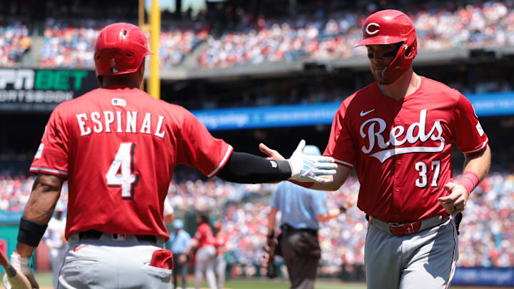 Jul 4, 2025; Philadelphia, Pennsylvania, USA; Cincinnati Reds catcher Tyler Stephenson (37) is congratulated by third base Santiago Espinal (4) after scoring during the second inning against the Philadelphia Phillies at Citizens Bank Park. Mandatory Credit: Bill Streicher-Imagn Images
