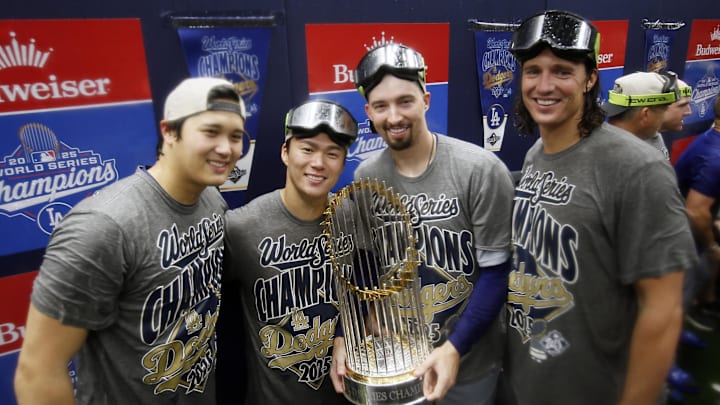 Oct 31, 2025; Toronto, Ontario, CAN; Los Angeles Dodgers two-way player Shohei Ohtani (17) and pitcher Yoshinobu Yamamoto (18) and pitcher Blake Snell (7) and pitcher Tyler Glasnow (31) celebrate with the Commissioner's Trophy in the clubhouse after defeating the Toronto Blue Jays in the 2025 MLB World Series at Rogers Centre. Mandatory Credit: John E. Sokolowski-Imagn Images Oct 31, 2025; Toronto, Ontario, CAN; Los Angeles Dodgers two-way player Shohei Ohtani (17) and pitcher Yoshinobu Yamamoto (18) and pitcher Blake Snell (7) and pitcher Tyler Glasnow (31) celebrate with the Commissioner's Trophy in the clubhouse after defeating the Toronto Blue Jays in the 2025 MLB World Series at Rogers Centre. Mandatory Credit: John E. Sokolowski-Imagn Images