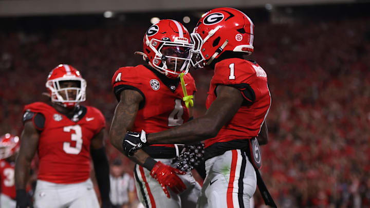 Sep 27, 2025; Athens, Georgia, USA; Georgia Bulldogs defensive back Ellis Robinson IV (1) and defensive back KJ Bolden (4) react in the first half against the Alabama Crimson Tide at Sanford Stadium. Mandatory Credit: Brett Davis-Imagn Images