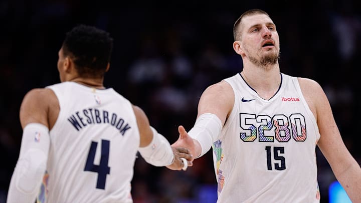 Jan 21, 2025; Denver, Colorado, USA; Denver Nuggets center Nikola Jokic (15) and guard Russell Westbrook (4) in the third quarter against the Philadelphia 76ers at Ball Arena. Mandatory Credit: Isaiah J. Downing-Imagn Images