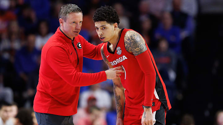 Jan 25, 2025; Gainesville, Florida, USA; Georgia Bulldogs head coach Mike White talks with Georgia Bulldogs guard Dakota Leffew (1) against the Florida Gators during the second half at Exactech Arena at the Stephen C. O'Connell Center. Mandatory Credit: Matt Pendleton-Imagn Images