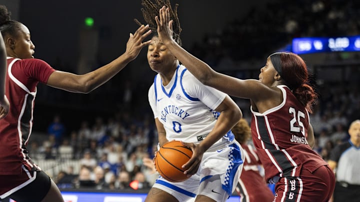 Mar 1, 2026; Lexington, Kentucky, USA; South Carolina Gamecocks guard Raven Johnson (25) and forward Joyce Edwards (8) guard Kentucky Wildcats guard Jordan Obi (0) during the fourth quarter at Memorial Coliseum. Mandatory Credit: Arden Barnes-Imagn Images Mar 1, 2026; Lexington, Kentucky, USA; South Carolina Gamecocks guard Raven Johnson (25) and forward Joyce Edwards (8) guard Kentucky Wildcats guard Jordan Obi (0) during the fourth quarter at Memorial Coliseum. Mandatory Credit: Arden Barnes-Imagn Images
