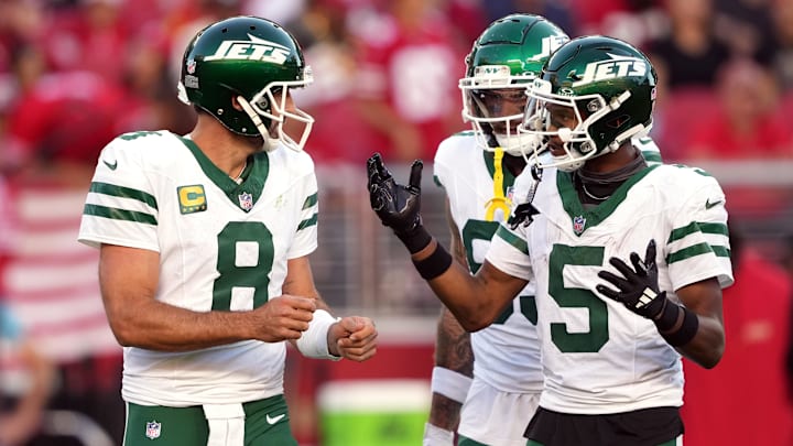 Sep 9, 2024; Santa Clara, California, USA; New York Jets quarterback Aaron Rodgers (8) and wide receiver Garrett Wilson (5) talk on the field during the second quarter against the San Francisco 49ers at Levi's Stadium. Mandatory Credit: Darren Yamashita-Imagn Images