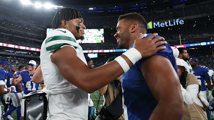 Aug 16, 2025; East Rutherford, New Jersey, USA; New York Jets quarterback Justin Fields (7) and New York Giants quarterback Russell Wilson (3) meet on the field after the preseason game at MetLife Stadium. Mandatory Credit: Vincent Carchietta-Imagn Images Aug 16, 2025; East Rutherford, New Jersey, USA; New York Jets quarterback Justin Fields (7) and New York Giants quarterback Russell Wilson (3) meet on the field after the preseason game at MetLife Stadium. Mandatory Credit: Vincent Carchietta-Imagn Images