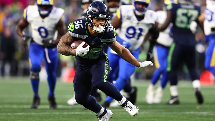 Seattle Seahawks running back George Holani (36) runs against the Los Angeles Rams during the first half in the 2026 NFC Championship Game. Seattle Seahawks running back George Holani (36) runs against the Los Angeles Rams during the first half in the 2026 NFC Championship Game.