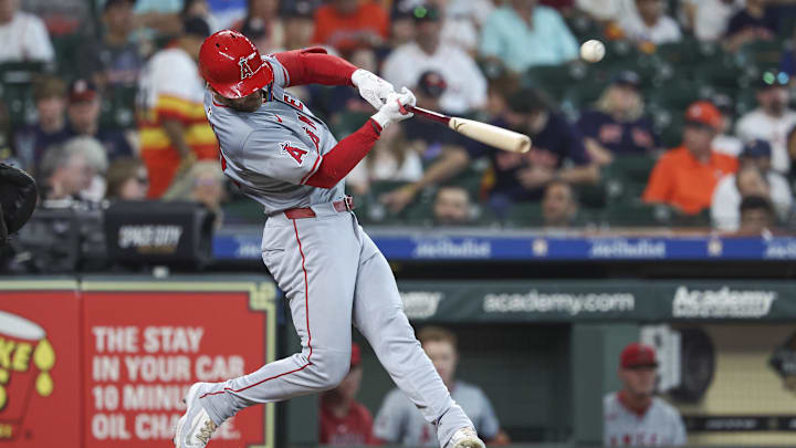 Sep 22, 2024; Houston, Texas, USA; Los Angeles Angels left fielder Taylor Ward (3) hits a single during the first inning against the Houston Astros at Minute Maid Park. 