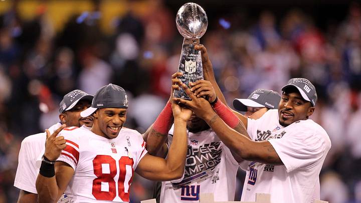 Feb 5, 2012; Indianapolis, IN, USA; New York Giants wide receiver Victor Cruz (80) and wide receiver Hakeem Nicks (right) hoist the Vince Lombardi Trophy after Super Bowl XLVI against the New England Patriots at Lucas Oil Stadium. Feb 5, 2012; Indianapolis, IN, USA; New York Giants wide receiver Victor Cruz (80) and wide receiver Hakeem Nicks (right) hoist the Vince Lombardi Trophy after Super Bowl XLVI against the New England Patriots at Lucas Oil Stadium.