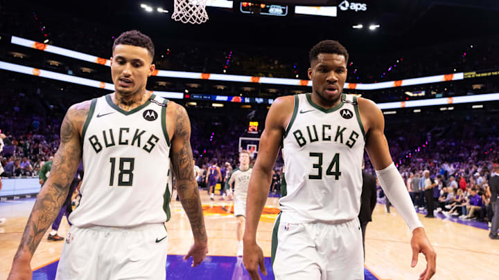 Mar 24, 2025; Phoenix, Arizona, USA; Milwaukee Bucks forward Kyle Kuzma (18) and forward Giannis Antetokounmpo (34) against the Phoenix Suns at Footprint Center. Mandatory Credit: Mark J. Rebilas-Imagn Images