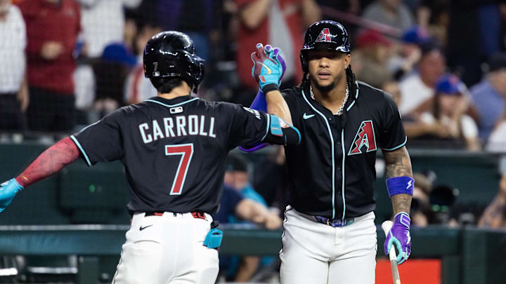 May 5, 2025; Phoenix, Arizona, USA; Arizona Diamondbacks outfielder Corbin Carroll (7) celebrates with Ketel Marte after hitting a home run in the first inning against the New York Mets at Chase Field. Mandatory Credit: Mark J. Rebilas-Imagn Images