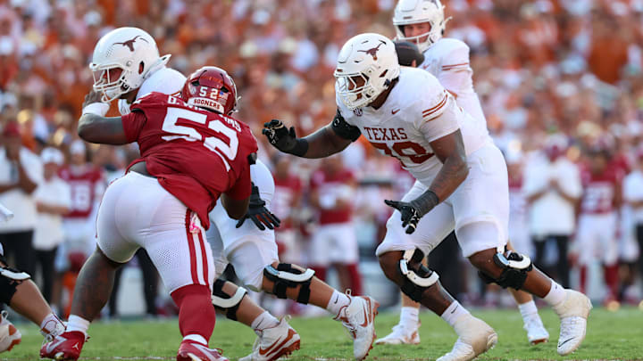 Oct 12, 2024; Dallas, Texas, USA;  Texas Longhorns offensive lineman Kelvin Banks Jr. (78) looks to block Oklahoma Sooners defensive lineman Damonic Williams (52) during the game at the Cotton Bowl. Mandatory Credit: Kevin Jairaj-Imagn Images