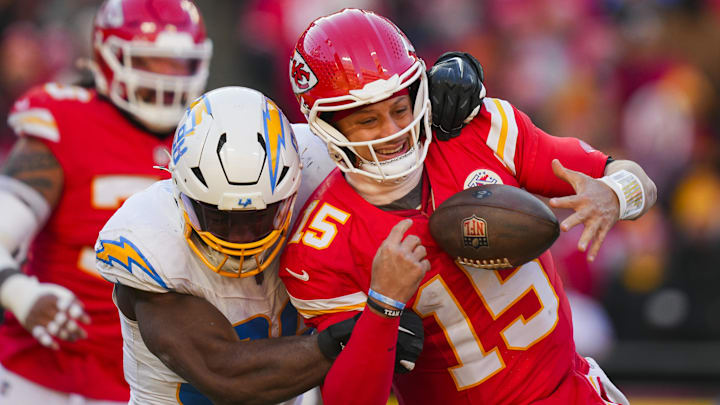 Dec 14, 2025; Kansas City, Missouri, USA; Kansas City Chiefs quarterback Patrick Mahomes (15) is sacked by Los Angeles Chargers linebacker Odafe Oweh (98) during the second half at GEHA Field at Arrowhead Stadium. Mandatory Credit: Jay Biggerstaff-Imagn Images Dec 14, 2025; Kansas City, Missouri, USA; Kansas City Chiefs quarterback Patrick Mahomes (15) is sacked by Los Angeles Chargers linebacker Odafe Oweh (98) during the second half at GEHA Field at Arrowhead Stadium. Mandatory Credit: Jay Biggerstaff-Imagn Images