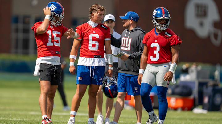 New York Giants quarterback Tommy DeVito (15), New York Giants quarterback Jaxson Dart (6), and Russell Wilson (3) stand together during day one of the New York Giants training camp at Quest Diagnostics Giants Training Center in East Rutherford on Wednesday, July 23, 2025.