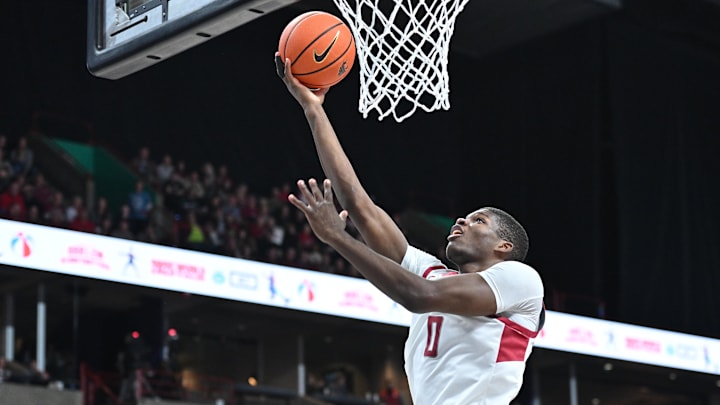 Nov 21, 2024; Spokane, Washington, USA; Washington State Cougars guard Cedric Coward (0) makes an easy lay up