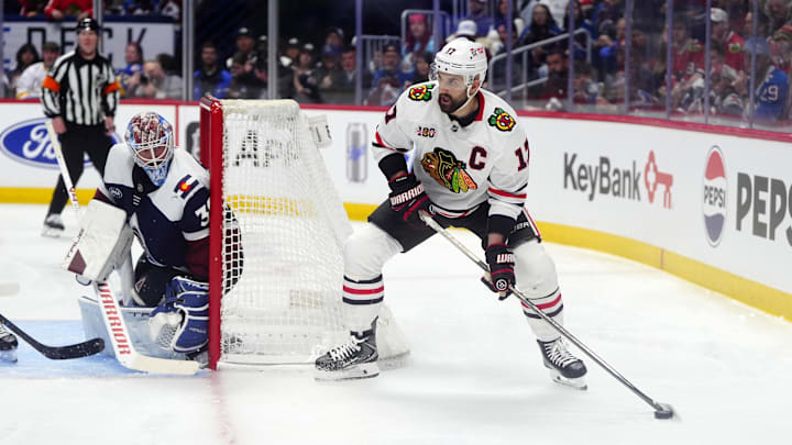 Feb 28, 2026; Denver, Colorado, USA; Chicago Blackhawks left wing Nick Foligno (17) behind the net of Colorado Avalanche goaltender MacKenzie Blackwood (39) in the third period at Ball Arena. Mandatory Credit: Ron Chenoy-Imagn Images