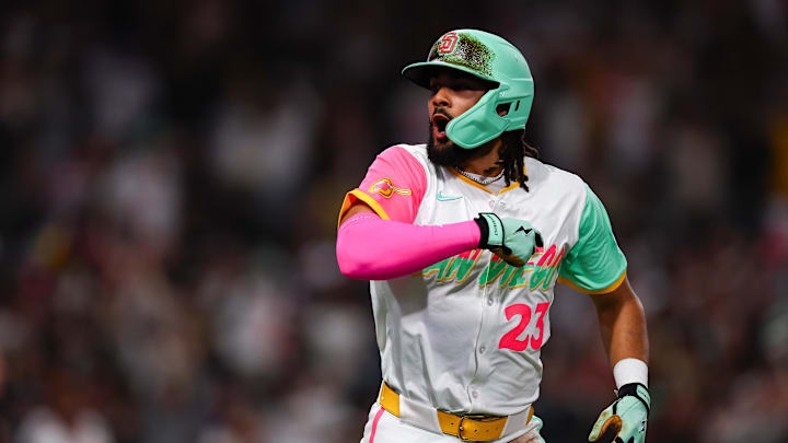 Apr 11, 2025; San Diego, California, USA; San Diego Padres right fielder Fernando Tatis Jr. (23) hits a solo home run in the sixth inning against the Colorado Rockies at Petco Park. Mandatory Credit: Chadd Cady-Imagn Images