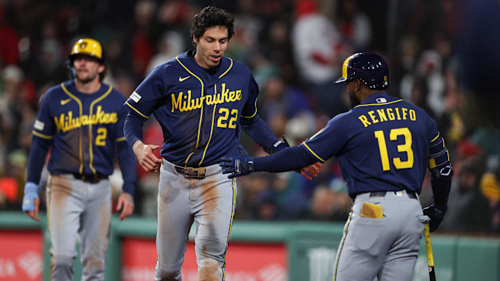 Apr 6, 2026; Boston, Massachusetts, USA; Milwaukee Brewers left fielder Christian Yelich (22) celebrates with Milwaukee Brewers second baseman Luis Rengifo (13) during the eighth inning against the Boston Red Sox at Fenway Park. Mandatory Credit: Paul Rutherford-Imagn Images