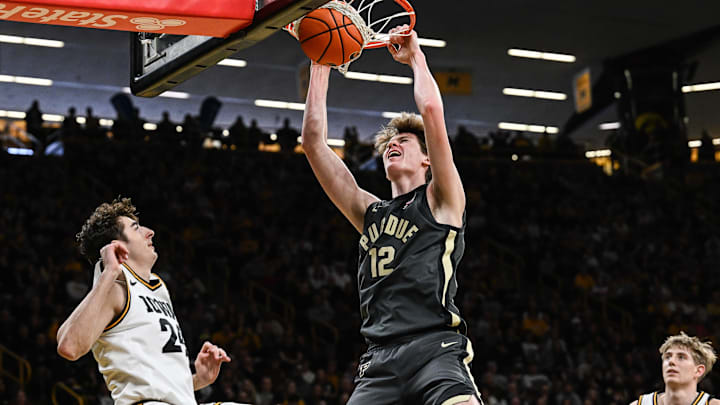 Purdue Boilermakers center Daniel Jacobsen (12) completes a slam dunk.