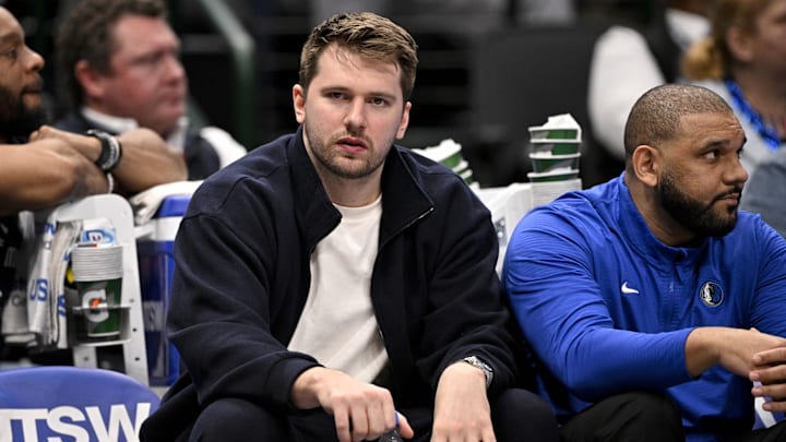 Jan 12, 2025; Dallas, Texas, USA; Dallas Mavericks guard Luka Doncic (77) reacts from the team bench during the second half of the game against the Denver Nuggets at the American Airlines Center. Mandatory Credit: Jerome Miron-Imagn Images