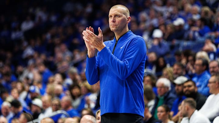 Oct 30, 2025; Lexington, KY, USA; Kentucky Wildcats head coach Mark Pope claps as he watches the action during the first half against the Georgetown Hoyas at Rupp Arena at Central Bank Center. Mandatory Credit: Jordan Prather-Imagn Images Oct 30, 2025; Lexington, KY, USA; Kentucky Wildcats head coach Mark Pope claps as he watches the action during the first half against the Georgetown Hoyas at Rupp Arena at Central Bank Center. Mandatory Credit: Jordan Prather-Imagn Images