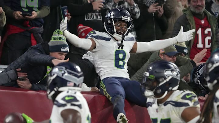 Nov 13, 2022; Munich, Germany; Seattle Seahawks cornerback Coby Bryant (8) celebrates with fans in the second half against the Tampa Bay Buccaneers during an NFL International Series game at Allianz Arena. Mandatory Credit: Kirby Lee-Imagn Images
