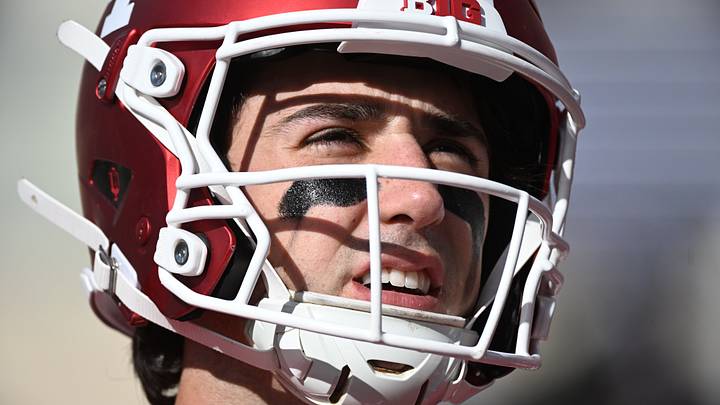 Josh Hoover warms up before the game against the Ohio State Buckeyes at Merchants Bank Field at Memorial Stadium.  