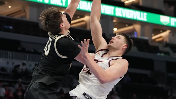 Mar 10, 2026; Charlotte, NC, USA; /s13/ blocks the shot of Virginia Tech Hokies center Christian Gurdak (32) in the second half at Spectrum Center. Mandatory Credit: Bob Donnan-Imagn Images