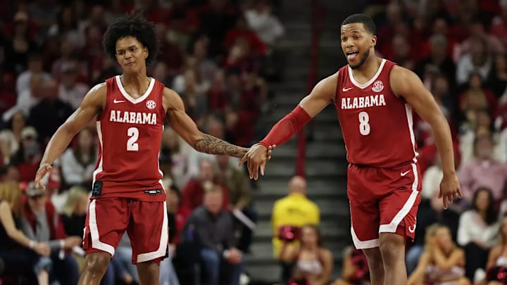 Alabama guard Aden Holloway (2) and Alabama guard Chris Youngblood (8) celebrate against Arkansas at Bud Walton Arena in Fayetteville, AR on Saturday, Feb 8, 2025.
