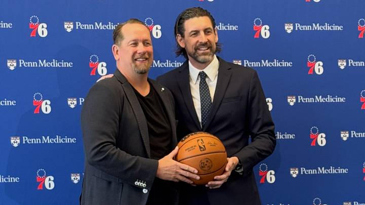 Nick Nurse and Mike Gansey pose for a photo at Gansey's introductory press conference with the Sixers