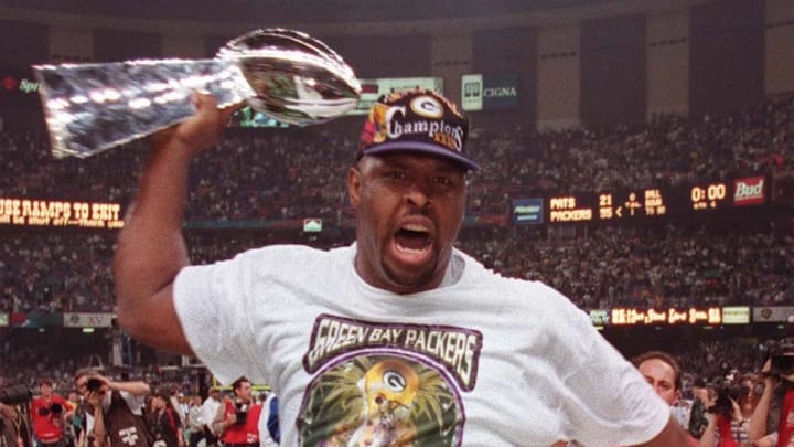 Reggie White screams while carrying the Lombardi Trophy after his team defeated the New England Patriots during in Super Bowl XXXI. Reggie White screams while carrying the Lombardi Trophy after his team defeated the New England Patriots during in Super Bowl XXXI.
