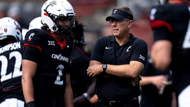 Cincinnati Bearcats head coach Scott Satterfield speaks with quarterback Brendan Sorsby earlier this year. The Bearcats head to Iowa State this weekend. Cincinnati Bearcats head coach Scott Satterfield speaks with quarterback Brendan Sorsby earlier this year. The Bearcats head to Iowa State this weekend.