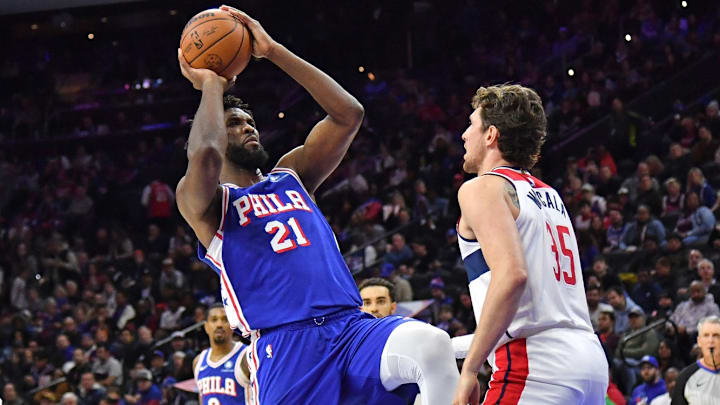 The Wizards working to defend Philadelphia 76ers center Joel Embiid The Wizards working to defend Philadelphia 76ers center Joel Embiid