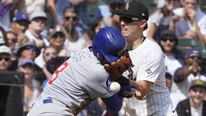 Chicago Cubs outfielder Ian Happ (8) collides with Chicago White Sox third baseman Colson Montgomery (12) at Rate Field. Chicago Cubs outfielder Ian Happ (8) collides with Chicago White Sox third baseman Colson Montgomery (12) at Rate Field.