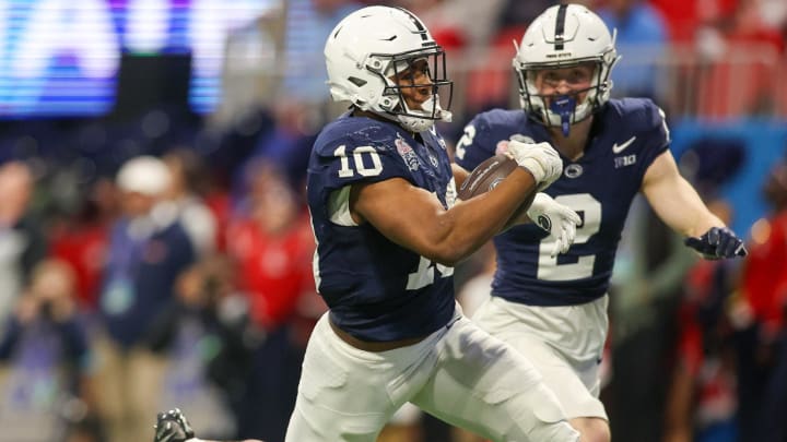 Penn State Nittany Lions running back Nicholas Singleton catches a touchdown pass against Ole Miss sin the Peach Bowl at Mercedes-Benz Stadium. 