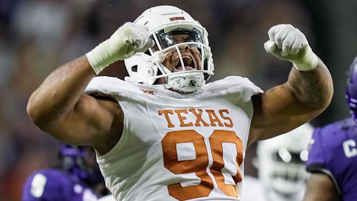 Texas Longhorns defensive lineman Byron Murphy II (90) celebrates after a sack against TCU Horned Frogs quarterback Josh Hoover (10) in the second quarter of an NCAA college football game at Amon G. Carter Stadium.