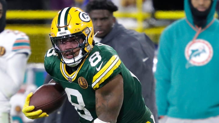 Green Bay Packers running back Josh Jacobs (8) runs for a long gain on a reception on Thursday.