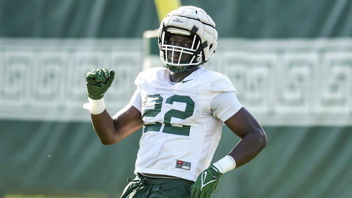 Michigan State defensive lineman Jordon Bai Jobe runs a drill during the opening day of MSU's