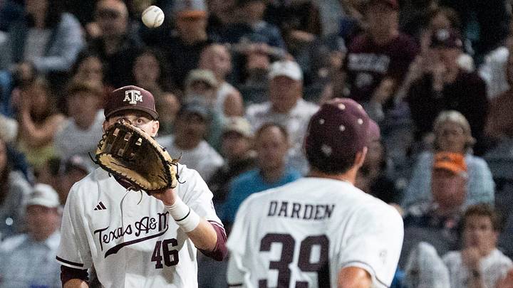 Texas A&M Aggies' Ethan Darden (39) flips the ball to Blake Binderup (46) for the force out at first base as Auburn Tigers take on Texas A&M Aggies during the SEC baseball tournament at Hoover Metropolitan Stadium in Hoover, Ala. on Friday, May 22, 2026.