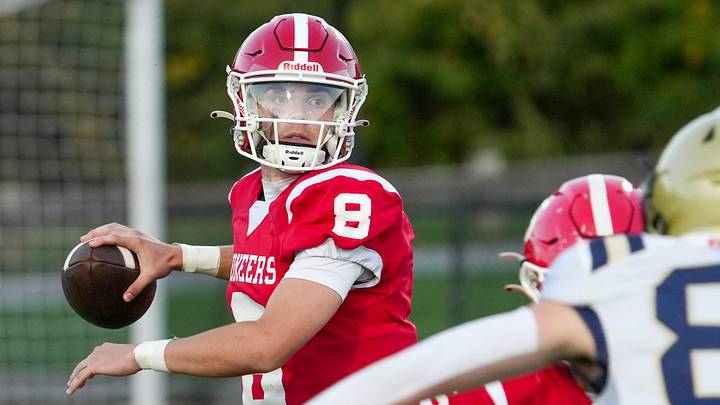 St. John’s starting quarterback Brad Perry looks for a receiver through the Shrewsbury defense Sept. 26. St. John’s starting quarterback Brad Perry looks for a receiver through the Shrewsbury defense Sept. 26.