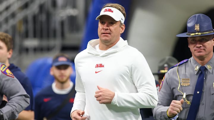 Dec 30, 2023; Atlanta, GA, USA; Mississippi Rebels head coach Lane Kiffin runs on the field before a regular season game.