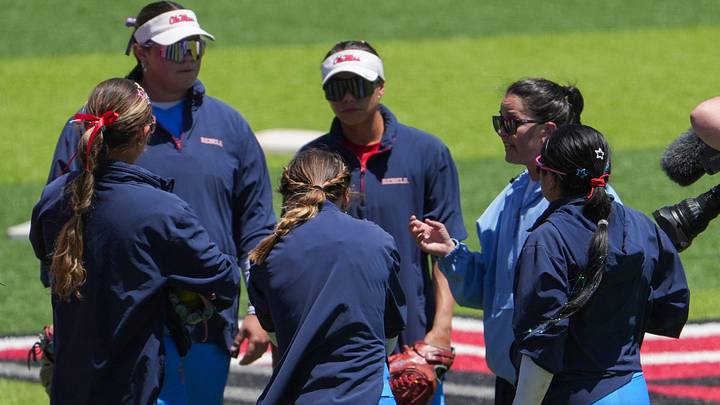 Ole Miss meets during warmups before facing Texas Tech during the Lubbock Regional of the NCAA Division I softball tournament. Ole Miss meets during warmups before facing Texas Tech during the Lubbock Regional of the NCAA Division I softball tournament.